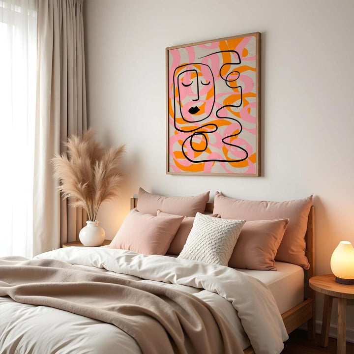 Picasso Rhythm of Euphoria poster displayed above a colorful modern chair in a cheerful, light-filled interior.